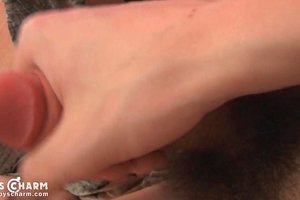 Young boy with big dick and hairy bush masturbating on a bed