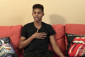 Cheerful athletic ebony guy is showing off his tasty body