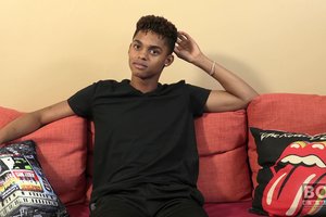 Cheerful athletic ebony guy is showing off his tasty body