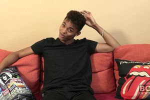 Cheerful athletic ebony guy is showing off his tasty body