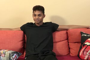 Cheerful athletic ebony guy is showing off his tasty body