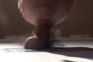 Slutty guy is sticking his naughty junk in a glory hole and getting it vibrated