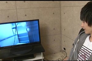 Curious asian guy is watching nasty bdsm porn with hot guys