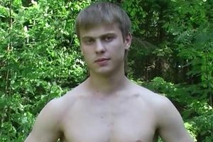 Athletic blonde guy is training and masturbating in the forest
